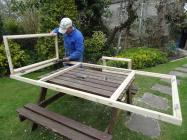 Dave Gadd building a window, Skomer Island, 2014