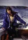 Rosanne Alexander steering the motor boat,...