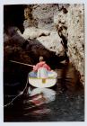 Boat at entrance to the Lantern cave, Skomer...