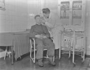 Garw First Aid Room, Man having eye examined,...