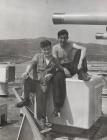 John Andrews and crew mate relax on the fore deck