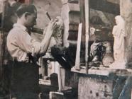 Harry Comley carving a religious sculpture