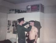 RRW soldiers preparing uniform in barracks